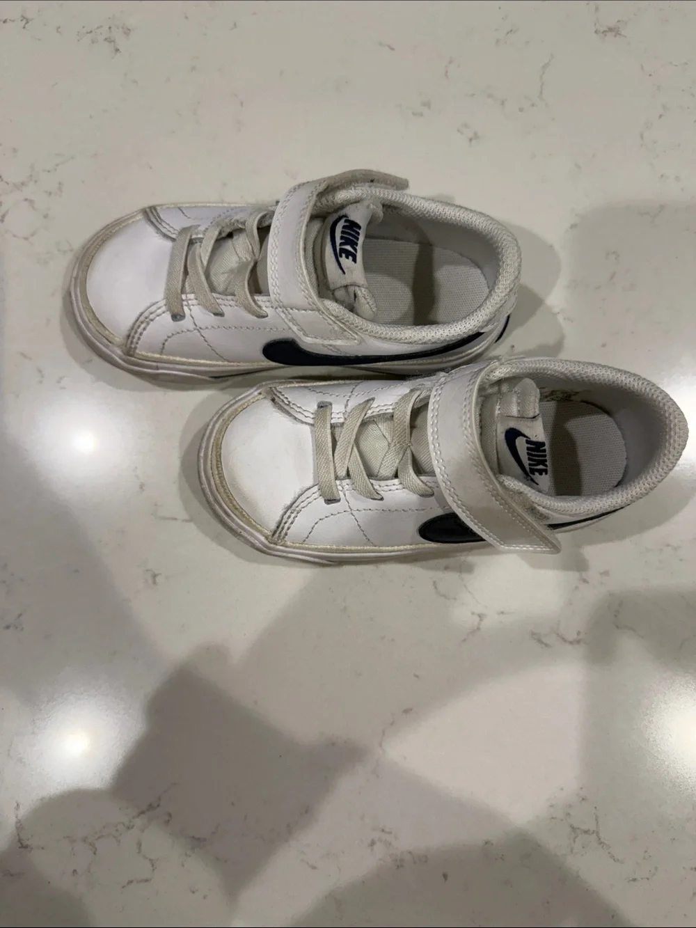 Nike Kids White Sneakers with Navy Swoosh and Velcro Strap